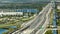 Aerial view of american freeway with many driving cars during rush hour in Miami, Florida. View from above of USA