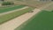 Aerial view of an amish family farm harvesting it\'s corn crop on a sunny autumn day