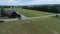 Aerial View of Amish Farm Land and a Horse and Buggy Going Down the Road