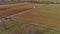 Aerial View of Amish Farm Worker Turning the Field in Early Spring as Seen by a Drone