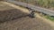 Aerial View of an Amish Farmer Harvesting His Autumn Crop of Corn With Five Horses Pulling his Harvester