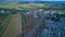 Aerial View of an Amish Mud Sale with Lots of Buggies and Farm Equipment