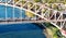 Aerial view of and Amtrak train crossing the Hell Gate Bridge in New York City