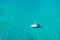 Aerial view of anchored sailing yacht in emerald sea. Aerial view of a boat. Outdoor water sports, yachting. Aerial view of