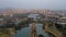 Aerial view of Anping Bridge an ancient Song dynasty stone bridge in Fujian province with city skyline at dusk