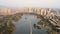 Aerial view of Anping Bridge an ancient Song dynasty stone bridge in Fujian province with city skyline at dusk