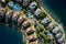 Aerial view of apartments with swimming pools surrounded by the sea