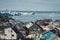 Aerial View of Arctic city of Ilulissat, Greenland. Colorful houses in the center of the town with icebergs in the