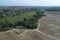 Aerial view of `Armazovo` village and ploughed land from the birds sight, Podolsk region, Russia