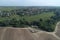 Aerial view of `Armazovo` village and ploughed land from the birds sight, Podolsk region, Russia