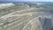 Aerial view asbestos mine open pit terrain at distant lake