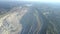 Aerial view asbestos open cast mining quarry by modern city