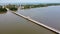 Aerial view. Asian tourist walking across the long bridge to the island. Long bridge crossing river.