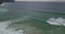 Aerial view of the Atlantic ocean with approaching waves  white spray