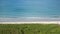 An aerial view of the Atlantic Ocean waves lapping on the beach in Ft. Pierce, Florida