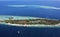 Aerial view of atolls and resort in the Maldives