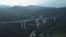 Aerial view of Austrian highway bridge above small town in the evening