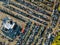 Aerial view of auto auction many used car lot parked distributed in a parking