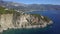 Aerial view of azure coast of the Adriatic Sea in Montenegro with emerald transparent water, rocks and cliffs in 4k