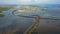 Aerial view of Bali Mandara toll road over sea. Car, motorbike bridge across the Gulf of Benoa connecting Denpasar city