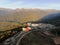 Aerial view balloon flight in the mountains. Beautiful panoramic landscape of the tourist complex at sunset in the mountains