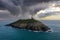 Aerial view of the Ballycotton lighthouse in county Cork, Ireland, at sunrise on cloudy rainy morning