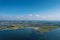 Aerial view on Ballyloughane Strand in Galway city, Ireland. High tide. Blue cloudy sky and ocean water. Popular area with amazing