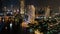 An aerial view of  Bangkok cityscape including Chao Phraya River during night time