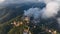 Aerial view of Barcelona Tibidabo above the clouds and fog, Catalonia, Spain