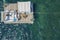 Aerial view of barge boat in the ocean. People relaxing on barge in the ocean.