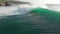 Aerial view of barrel wave in ocean and surfers. Surfing and waves