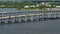Aerial view of Barron Collier Bridge and Gilchrist Bridge in Florida with moving traffic. Transportation infrastructure