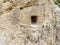 Aerial view of bas-reliefs carved in the rock that adorn the entrance frame of a house carved into the rock. Eastern Turkey