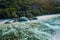 Aerial view of bay with shallow water on early morning of unique Anse Source D'Argent tropical beach, La Digue