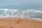 Aerial view of the beach in Biarritz, France. Surfers on the beach and in the ocean. Active holidays.