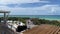 An aerial view of the Beach with Blue Umbrella and Lounge Chairs lined up at the Watercolor Community Club in Watercolor, Florida