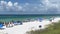 An aerial view of the Beach with Blue Umbrella and Lounge Chairs lined up at the Watercolor Community Club in Watercolor, Florida