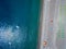 Aerial view of a beach with canoes, boats and umbrellas. Praia a Mare, Province of Cosenza, Calabria, Italy