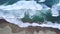 Aerial view of beach with frothy wave