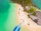 Aerial view of beach at Koh Khai, a small island, with crowd of people, tourists, blue turquoise seawater with Andaman sea in