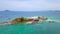 Aerial view of beach at Koh Khai, a small island, with crowd of people, tourists, blue turquoise seawater with Andaman sea in