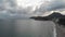 Aerial view of the beach near Bar, Montenegro. Drone sight of a small seaside town with mountains and waves in the sand