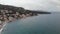 Aerial view of the beach near Bar, Montenegro. Drone sight of a small seaside town with mountains and waves in the sand