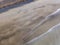 Aerial view of a beach, shore, waves crashing on the coast. Famara Beach. Lanzarote, Spain