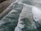 Aerial view of a beach, shore, waves crashing on the coast. Famara Beach. Lanzarote, Spain