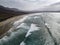 Aerial view of a beach, shore, waves crashing on the coast. Famara Beach. Lanzarote, Spain