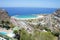 Aerial view of a beachside resort area under the blue sky on a sunny summer day