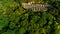 Aerial view of beautiful ancient fortress in forest in summer. Tarakaniv Fort.