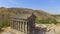 Aerial view of beautiful ancient Garni temple, tourists enjoying tour, Armenia