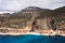 Aerial view of a beautiful bay with a beach and turquoise sea among big mountains. Kaputas beach, Kas, Türkiye.